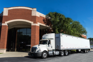 Semi-truck parked in front of CRD Logistics Company New York corporate building